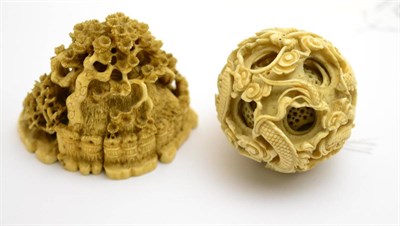 Lot 387 - A 19th century ivory puzzle ball (damages) and a Japanese ivory group (signed) (damages) (2)