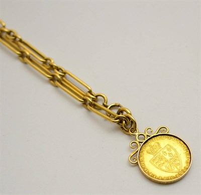 Lot 395 - A 1788 spade guinea loose mounted as a pendant on a trombone link two-part chain, links stamped...