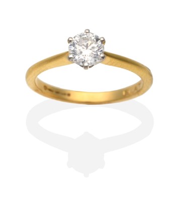 Lot 237 - An 18 Carat Gold Solitaire Diamond Ring, a round brilliant cut diamond in a claw setting, to...