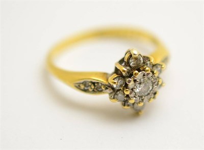 Lot 403 - An 18ct gold, platinum and diamond cluster ring