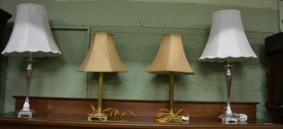 Lot 431 - A pair of brass table lamps and a pair of silver lacquered table lamps (4)