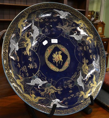 Lot 437 - A large Japanese charger decorated with birds on a blue ground, circa 1900