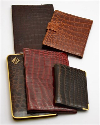 Lot 442 - A 1930's crocodile wallet with French 18ct gold corners, two unmounted wallets, a cigarette...