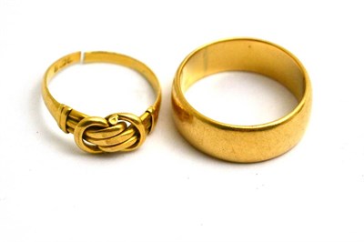 Lot 469 - An 18ct gold band ring and an 18ct gold knot ring, marks rubbed shank split