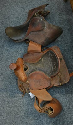 Lot 1015 - Two saddles and a group of tack