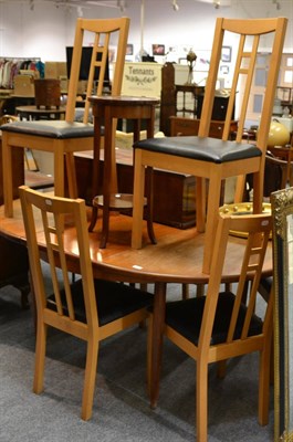 Lot 1035 - A circular extending table, a mahogany plant stand and six chairs