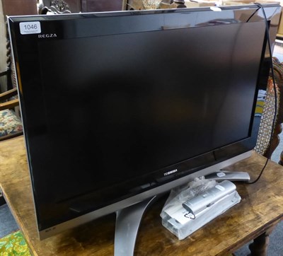 Lot 1046 - Toshiba TV, remote and brackets