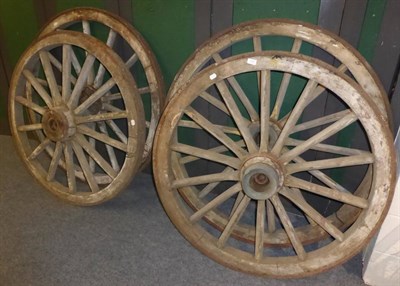 Lot 1081 - Four iron bound wooden cart wheels