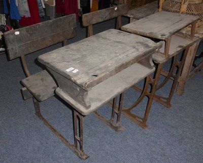 Lot 1082 - Two late 19th/early 20th century school desks with wrought iron frames