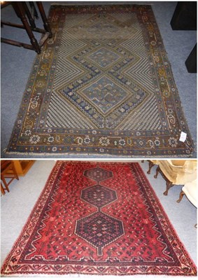 Lot 1089 - Kashgai rug, South West Persia, the rose pink field with three stepped medallions framed by...