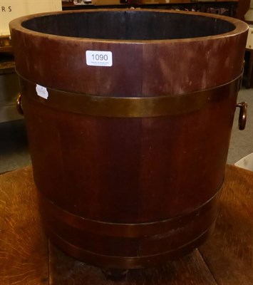 Lot 1090 - A coopered barrel form twin handled log bucket