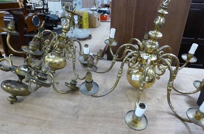 Lot 1096 - Three Dutch style brass candelabra