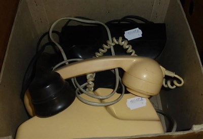 Lot 1119 - A vintage black Bakelite telephone and a cream telephone