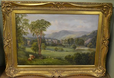 Lot 1169 - Attributed to Albert Goodwin (1845-1932) cattle grazing before Bolton Abbey, initialled and...