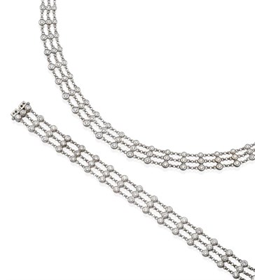 Lot 272 - An 18 Carat White Gold Diamond Necklace and Bracelet Suite, each of three rows of round...
