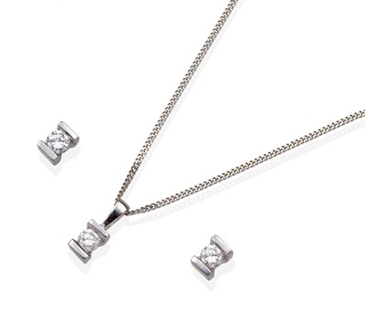 Lot 274 - An 18 Carat White Gold Solitaire Diamond Pendant and Earring Suite, the pendant set with a...