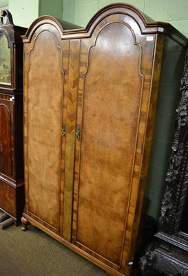 Lot 1211 - A Wearing & Gillows walnut double wardrobe