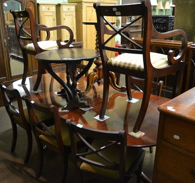 Lot 1219 - A mahogany twin pedestal extending dining table (one additional leaf) together with a set of...