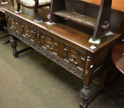 Lot 1221 - A Jacobean style carved oak dresser base with two drawers