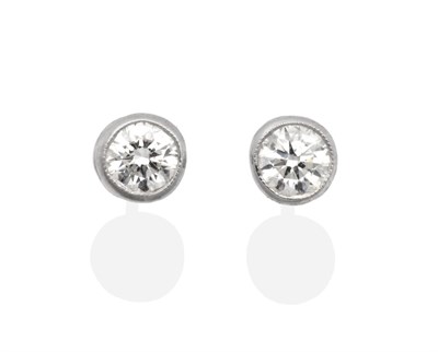 Lot 277 - A Pair of Solitaire Diamond Earrings, round brilliant cut diamonds in milgrain settings, total...