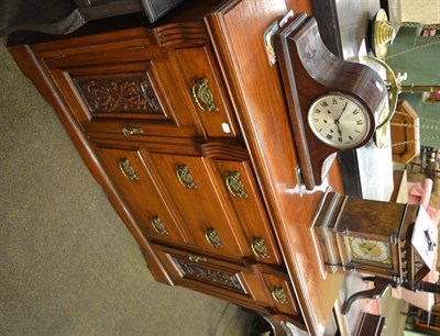 Lot 1238 - An early 20th century sideboard with carved decoration