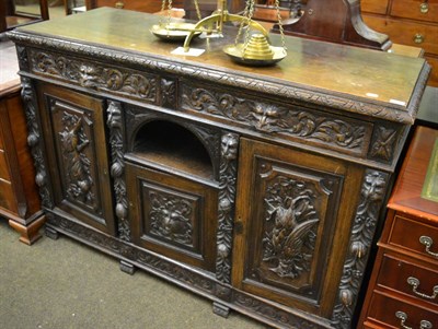 Lot 1244 - A Victorian carved oak sideboard