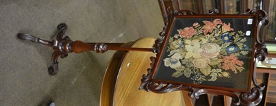 Lot 1250 - A Victorian mahogany pole screen on tripod base with floral woolwork insert