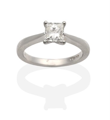 Lot 281 - A Platinum Radiant Cut Solitaire Diamond Ring, in a claw setting, to knife edge shoulders,...