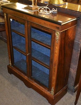 Lot 1254 - A walnut veneered glazed bookcase