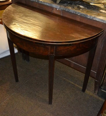 Lot 1255 - A George III demi-lune fold over tea table