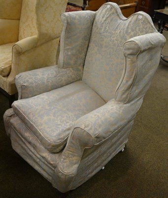 Lot 1262 - A late 19th century hump back wing armchair with blue and cream upholstery