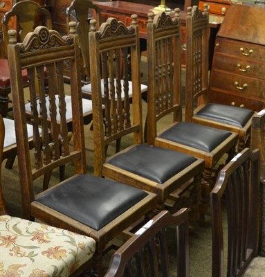 Lot 1268 - A set of four oak dining chairs with carved backs