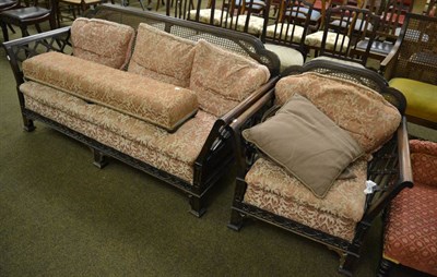 Lot 1271 - Late Victorian bergere sofa and matching chair with cockpen carving and a long footstool, all...