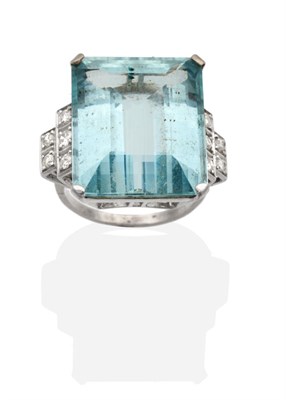 Lot 284 - An Aquamarine and Diamond Ring, an octagonal cut aquamarine in a claw setting, to stepped old...