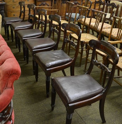 Lot 1275 - A set of six mahogany dining chairs, circa 1830, with gadrooned curved top rails above C scroll...