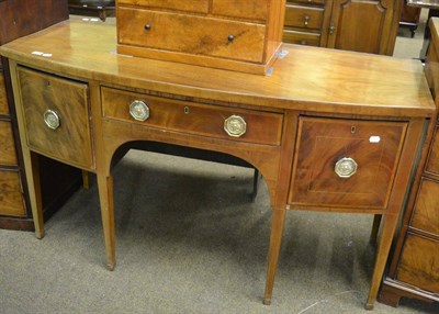 Lot 1289 - A Georgian mahogany bow front sideboard