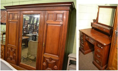 Lot 1319 - A large late Victorian walnut triple wardrobe, a similar dressing table, two bedroom chairs and...