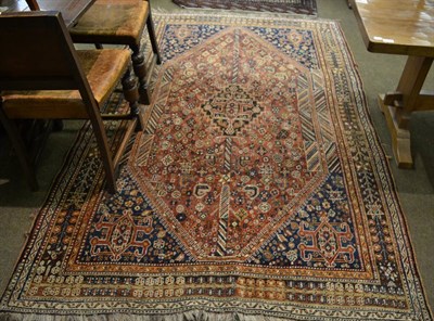 Lot 1323 - A Kashgai rug, South West Persia, the madder field centred by a stepped medallion surrounded by...