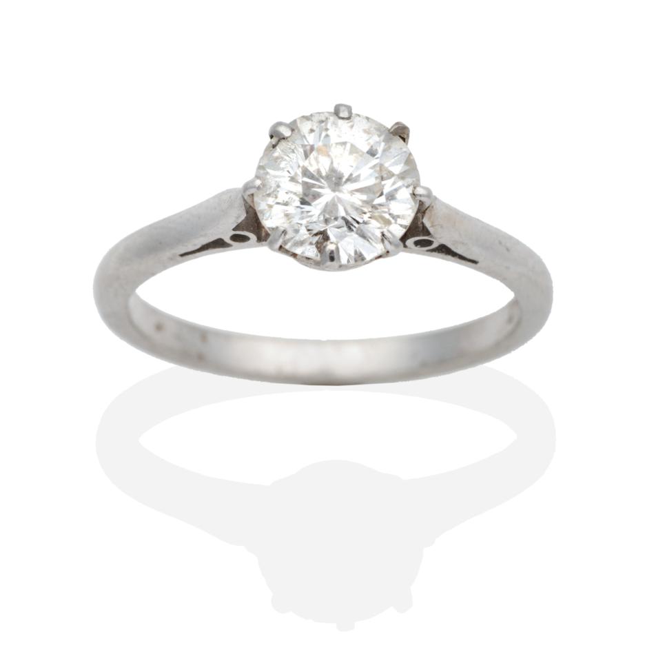 Lot 292 - A Solitaire Diamond Ring, a round brilliant cut diamond in a claw setting, to knife edge shoulders