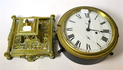 Lot 23 - A brass inkwell and a ship's type bulkhead timepiece