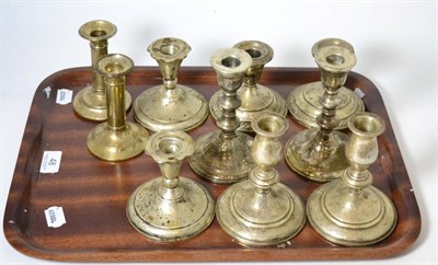 Lot 48 - Five pairs of white metal dwarf candlesticks