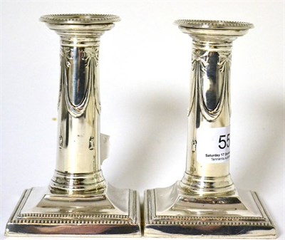 Lot 55 - A pair of silver candlesticks, by Goldsmith and Silversmith Co. 1903, London (2)