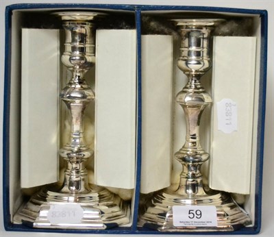 Lot 59 - A pair of Georgian style silver candlesticks, by James Dixon & Sons, Sheffield marks (2)