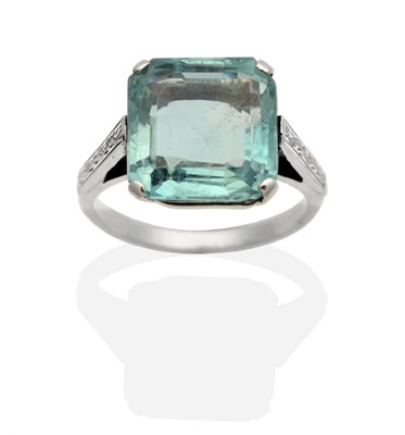 Lot 304 - An Early 20th Century Aquamarine Ring, a square octagonal cut aquamarine in a claw setting, to...