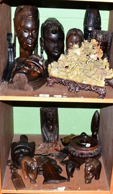 Lot 83 - A quantity of tribal busts and masks and a pair of floral carved soapstone ornaments (on two...