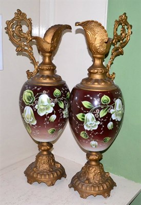 Lot 88 - A pair of Victorian glass and gilt metal ewers