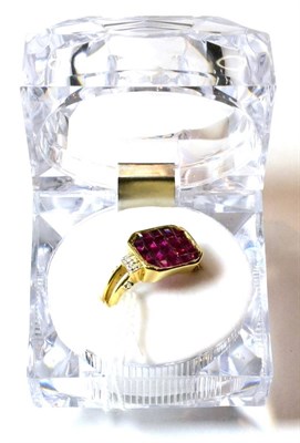 Lot 125 - A 9ct gold ruby and diamond ring