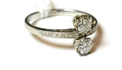 Lot 131 - A diamond two stone twist ring