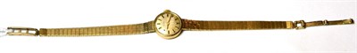 Lot 138 - A lady's 9ct gold cased Tissot wristwatch on a 9ct gold bracelet strap