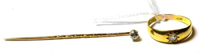 Lot 141 - A 22ct gold and diamond ring and a diamond stick pin